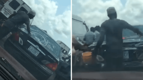 Lagos Hustle: Man Spotted Washing Car in Traffic (Video)