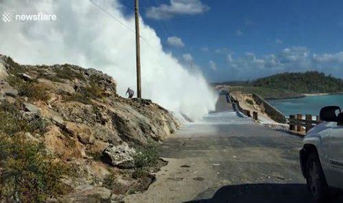 Watch The Shocking Moment A Man Was Swept Off A Bridge By Giant Waves In The Bahamas (Video)