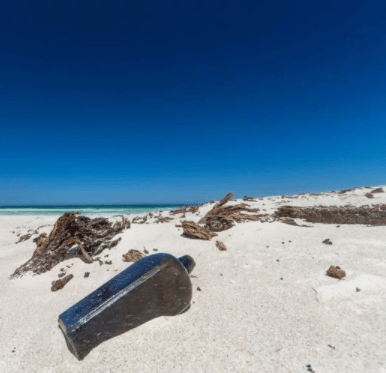World’s oldest message in a bottle (from 1886) found half-buried in beach