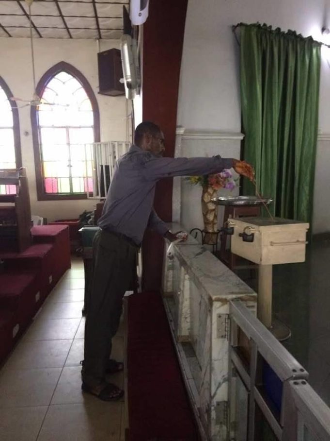 Man Caught Red-Handed While Using Wire To Steal From A Tithe Box (See photos)