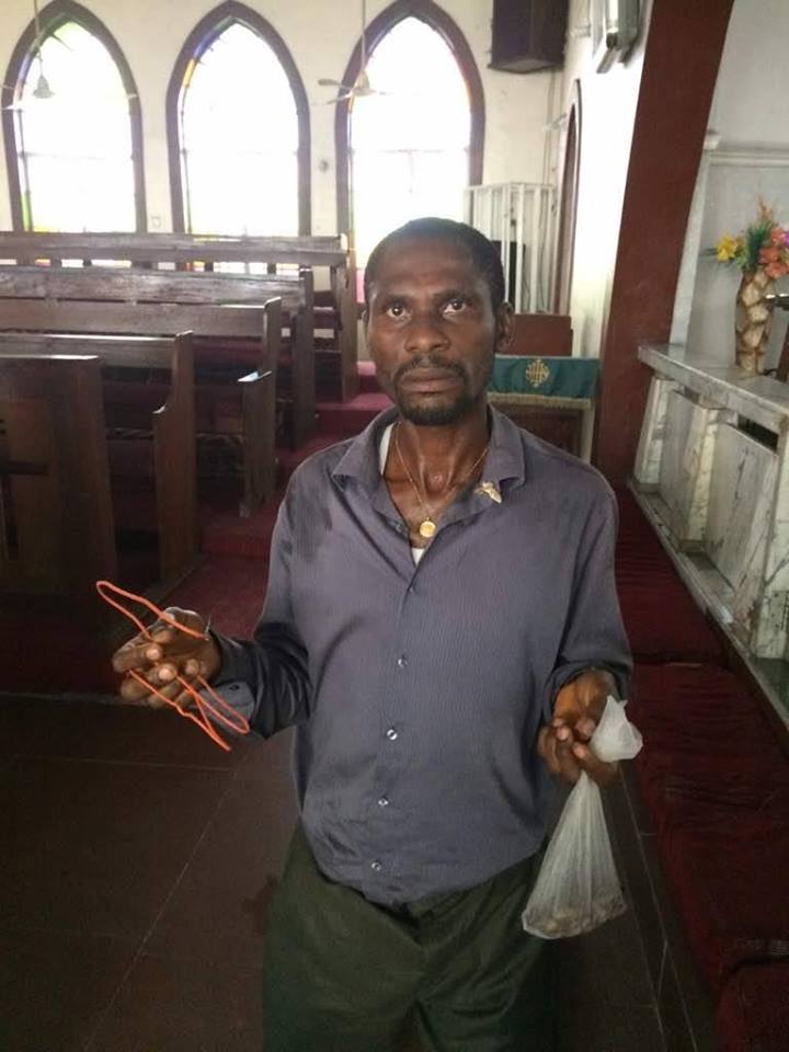 Man Caught Red-Handed While Using Wire To Steal From A Tithe Box (See photos)