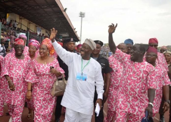 Moshood Salvador, in white, acknowledges cheers at the Agege Stadium. Photo- Babatunde Atolagbe-NAN