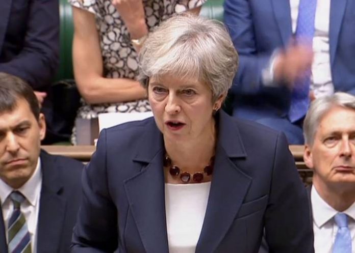 A video grab from footage broadcast by the UK Parliament's Parliamentary Recording Unit (PRU) shows Britain's Prime Minister Theresa May as she makes a statement to MPs in the House of Commons in London on September, 2018, on the progress of the police investigation into the March 4 nerve agent attack in Salisbury, on former Russian spy Sergei Skripal and his daughter Yulia.British prosecutors said Wednesday they have a European arrest warrant for two Russians suspected of a nerve agent attack on a former spy in the city of Salisbury. Police identified Alexander Petrov and Ruslan Boshirov as the men who allegedly tried to kill Russian former double agent Sergei Skripal and his daughter Yulia with Novichok in March. / AFP PHOTO / PRU AND AFP PHOTO / HO /