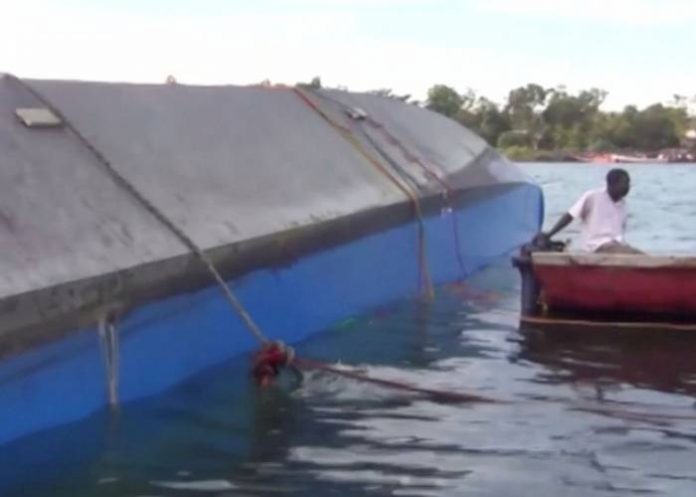 Rescue workers examine the hull of a ferry that overturned in Lake Victoria, Tanzania September 21, 2018, in this still image taken from video. Reuters TV-via REUTERS