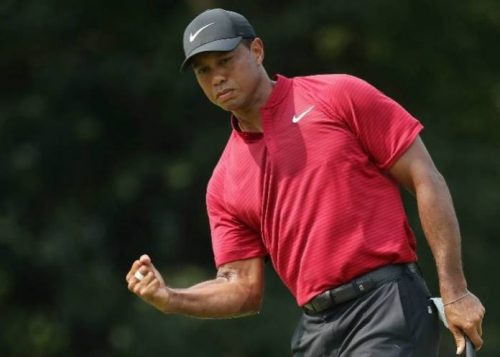 Tiger Woods seizes share of early lead at tour championship