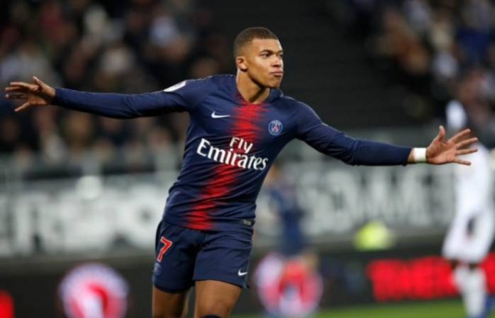 PSG’s Kylian Mbappe celebrates after scoring his side’s second goal during the French League One soccer match between Amiens and Paris-Saint-Germain at the Stade de la Licorne stadium in Amiens, France, Saturday, Jan. 12, 2019. (Christophe Ena/Associated Press)